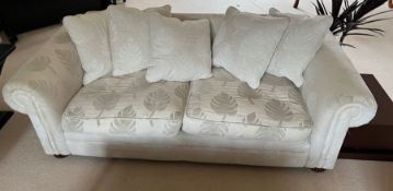 A large two seater sofa with leaf design (H73cm W210cm D102cm)