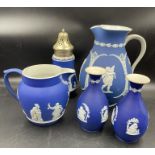 A selection of five dark blue jasperware pieces by Wedgwood (Large jug unmarked)
