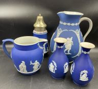 A selection of five dark blue jasperware pieces by Wedgwood (Large jug unmarked)