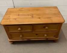 A low pine chest of drawers, two over one (H54cm W92cm D45cm)