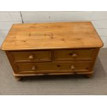 A low pine chest of drawers, two over one (H54cm W92cm D45cm)