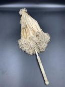 An antique ivory handled parasol AF