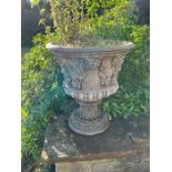 A pair of Bacchus relief garden urns