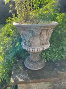 A pair of Bacchus relief garden urns