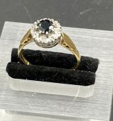 An 18ct gold sapphire and diamond ring, size Q, total weight 3.5g.
