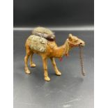 A cold painted bronze pin cushion in the form of a camel.