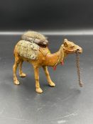 A cold painted bronze pin cushion in the form of a camel.