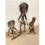 Three African or Indonesian tribal fertility figures