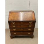 Georgian oak bureau opening to pigeon holes and writing surface (H96cm W82cm D48cm)