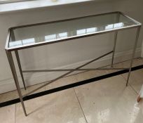 A chrome and glass console table (H75cm W111cm D36cm)