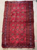 A red rug with floral pattern and geometric pattern 143cm x 96cm