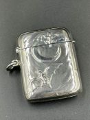 A Sterling silver vesta with bat and moon design