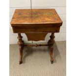 A burr walnut Edwardian in style folding games table