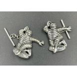 A Pair of sterling silver Michelin man cuff links