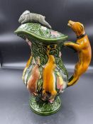 A china lidded jug with hunting theme.