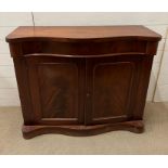 A mahogany side cabinet with serpentine front (H88cm W107cm D40cm)