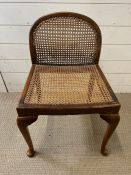 A cane and mahogany side chair