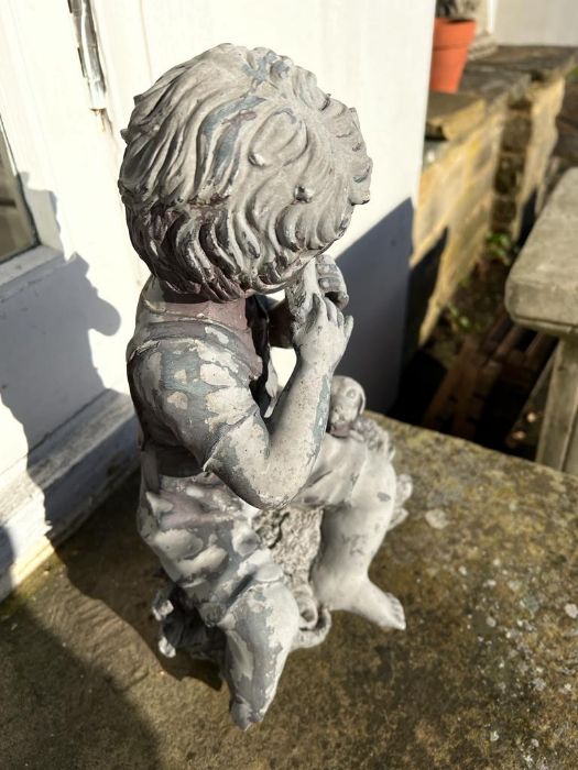 A garden ornament of a boy playing a flute AF - Image 3 of 5