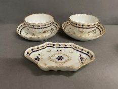 A Pair of Worcester tea bowls and saucers and small dish, late 18th century.