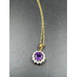 A 9ct gold necklace with diamond and semi precious stone pendant (Total Weight 1.6g)
