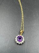 A 9ct gold necklace with diamond and semi precious stone pendant (Total Weight 1.6g)