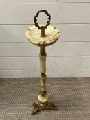 An onyx and brass floor standing ashtray