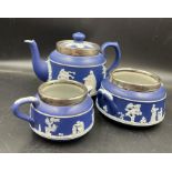 A Dark Blue Adams tea service with hallmarked silver rim.