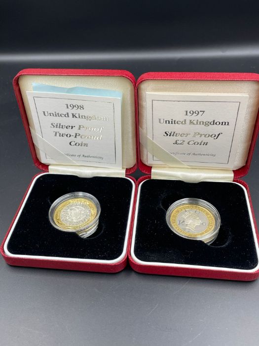 Two silver proof £2 coins for 1997 and 1998.
