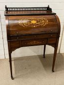 A rosewood cylinder desk, marquetry front revealing pigeon holes and drawers, pull out side with