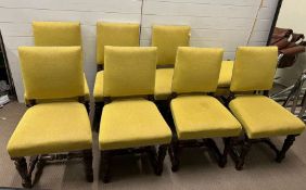 A set of eight oak dining chairs.