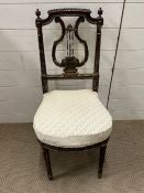 A Louis XVI style theatre chair on turned and fluted legs