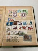 Fourteen albums of world stamps assorted countries, and ages.