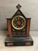 A large slate mantel clock with coloured pillar design on square form