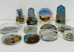 A selection of various glass paperweights