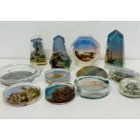 A selection of various glass paperweights