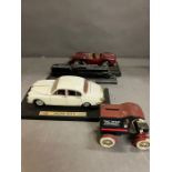 Four model cars and a train