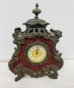 An ornate mantle clock