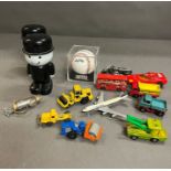 A selection of various toys, baseball, vehicles and moneyboxes