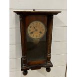 An oak cased wall clock