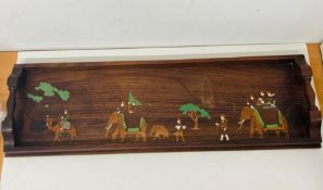 A wooden tray with painted scene
