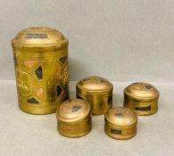 A tea caddy tin along with four smaller size tins