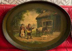 An oval Papier Mache tea tray decorated with family scene