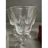 Military engraved glasses, decanter and lidded candle