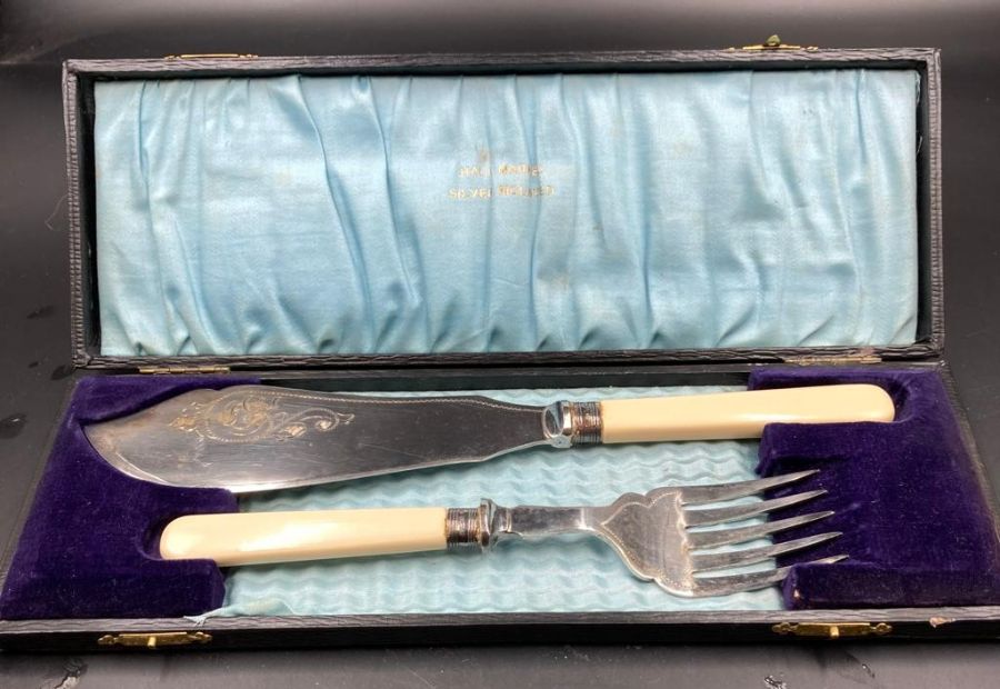 A cased set of silver mounted bone handled fish servers