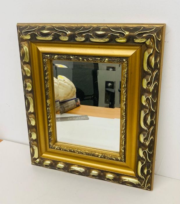 A gilt framed mirror