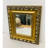 A gilt framed mirror