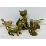 A selection of brass animals, birds, squirrel, dog and a cat