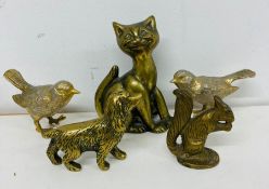 A selection of brass animals, birds, squirrel, dog and a cat