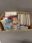 A large selection of various postcards