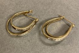 A pair of 9ct gold and diamond earrings (Approximate Total Weight 5.9g)